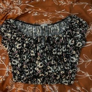 Black crop top with a key hole cut out on top of shirt